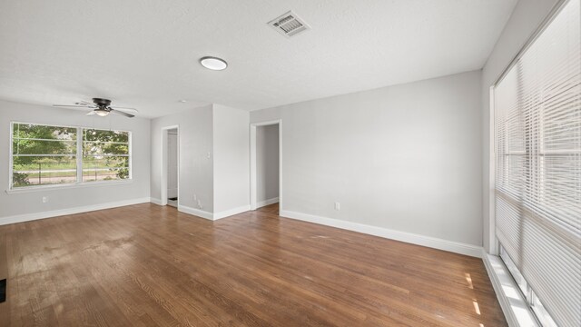 spare room featuring hardwood / wood-style flooring and ceiling fan