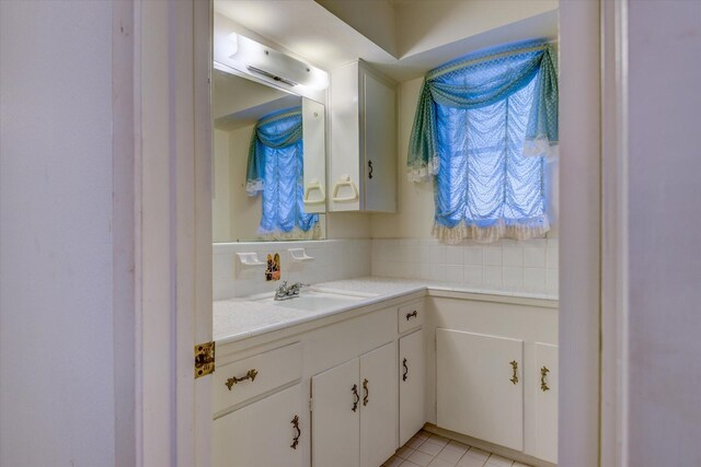 bathroom with vanity and tile patterned flooring