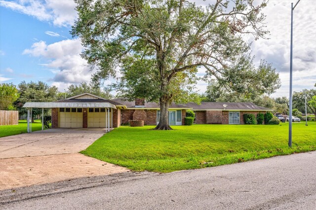 single story home with a garage and a front yard