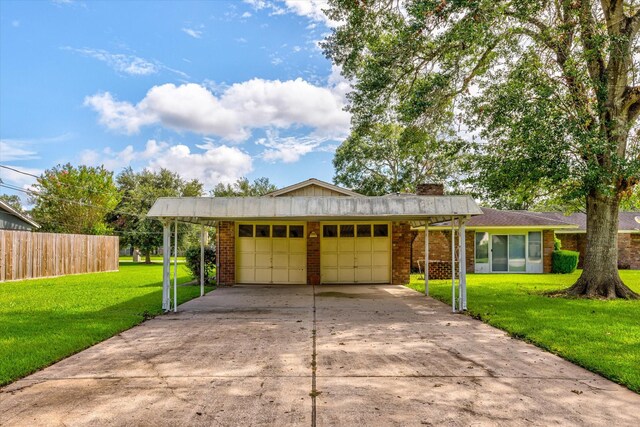 ranch-style home with a garage and a front yard