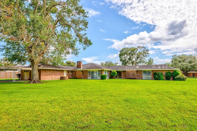 ranch-style house with a front yard