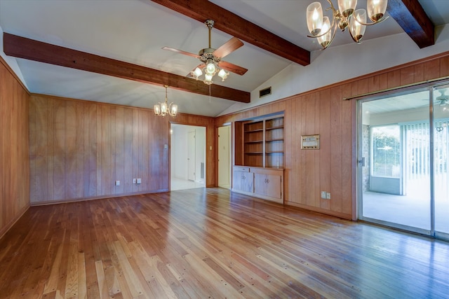 interior space with built in features, vaulted ceiling with beams, ceiling fan with notable chandelier, and light wood-type flooring