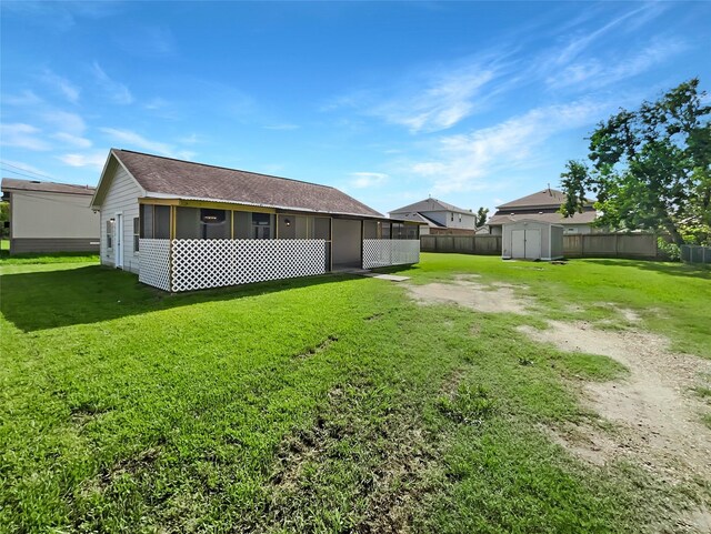 exterior space featuring a storage shed and a yard