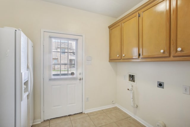 laundry area featuring light tile patterned floors, electric dryer hookup, hookup for a washing machine, cabinets, and hookup for a gas dryer