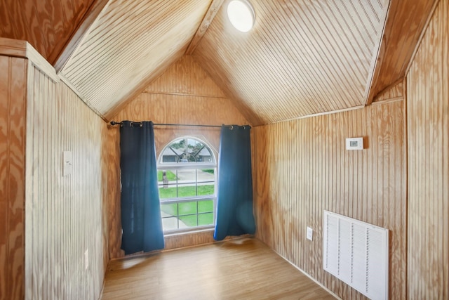 bonus room with wooden ceiling, light hardwood / wood-style floors, vaulted ceiling, and wood walls