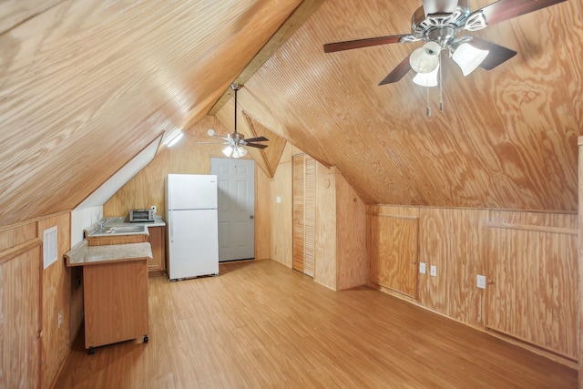 bonus room featuring wood ceiling, vaulted ceiling, light hardwood / wood-style floors, and wood walls