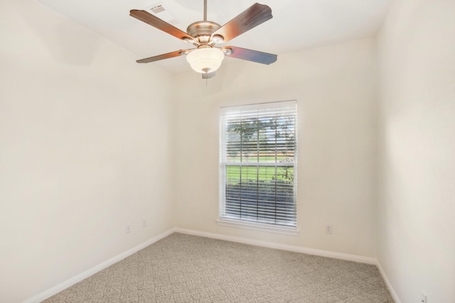 spare room with carpet and ceiling fan