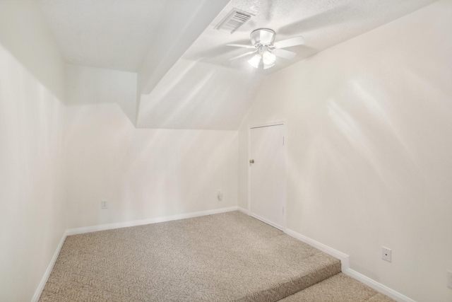 bonus room with lofted ceiling, carpet floors, and ceiling fan