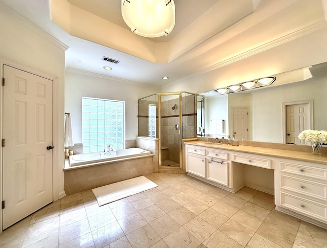 bathroom featuring ornamental molding, vanity, shower with separate bathtub, and a raised ceiling