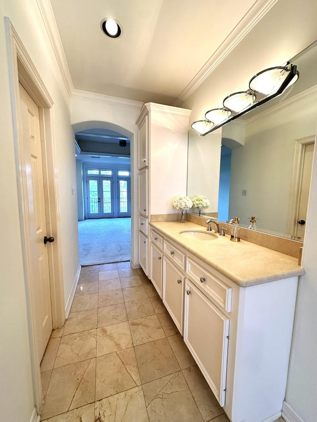 bathroom featuring crown molding, vanity, and french doors