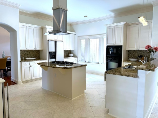 kitchen with sink, black appliances, white cabinets, island exhaust hood, and dark stone counters