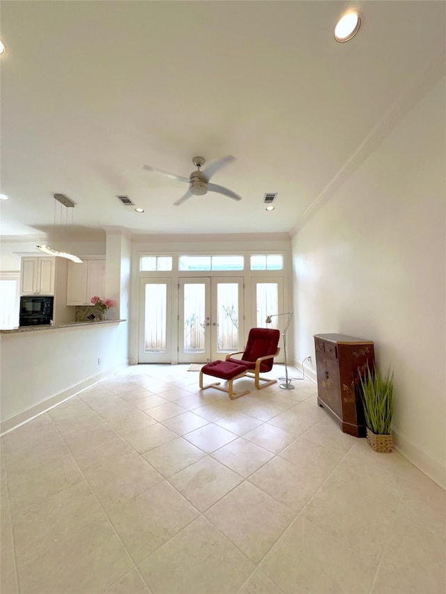 unfurnished room featuring french doors, ceiling fan, ornamental molding, and light tile patterned floors