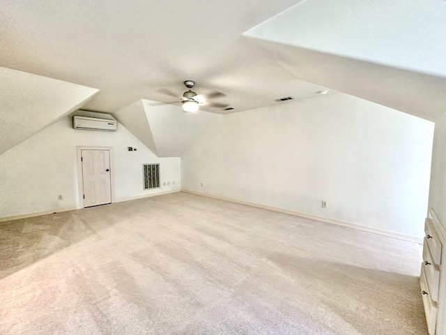 additional living space with lofted ceiling, light carpet, an AC wall unit, and ceiling fan