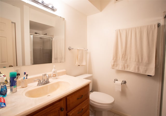 bathroom featuring tile patterned floors, toilet, and vanity