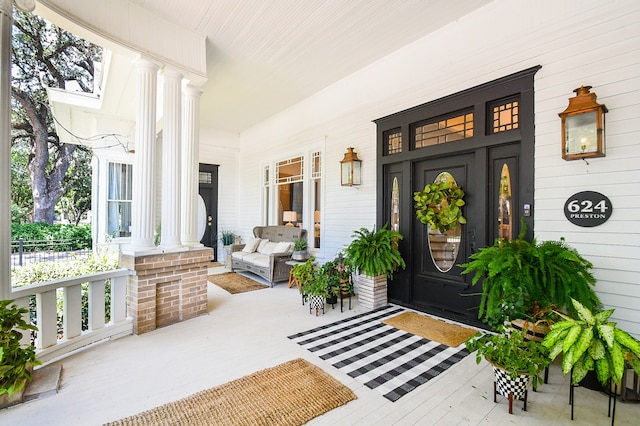 doorway to property with a porch