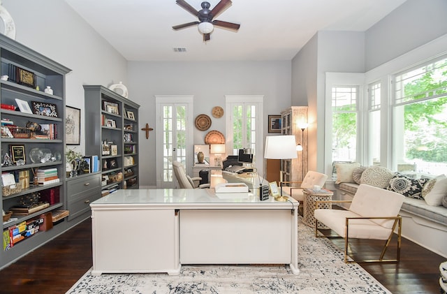 office space with french doors, dark hardwood / wood-style floors, ceiling fan, and a healthy amount of sunlight