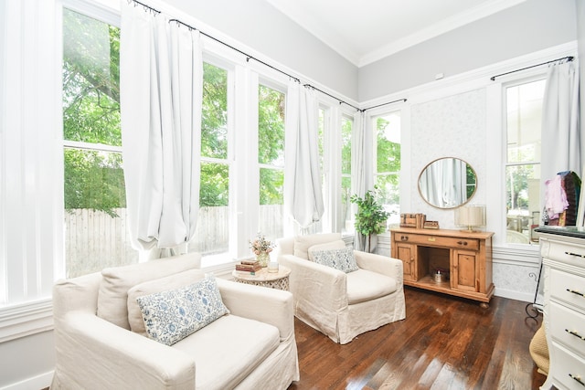 sitting room with dark hardwood / wood-style flooring and ornamental molding