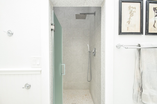 bathroom with a tile shower