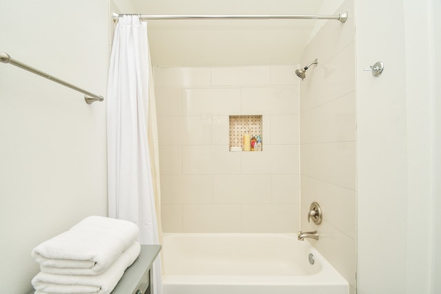 bathroom with shower / bath combination with curtain