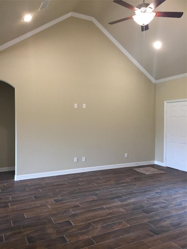 unfurnished room featuring dark wood-type flooring, ornamental molding, lofted ceiling, and ceiling fan