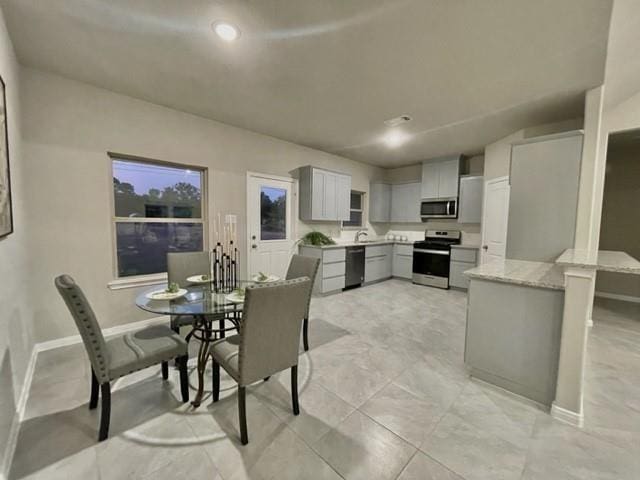 dining space with sink