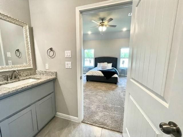 bathroom with ceiling fan and vanity