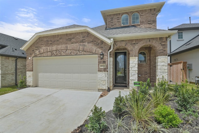 view of front of property featuring a garage