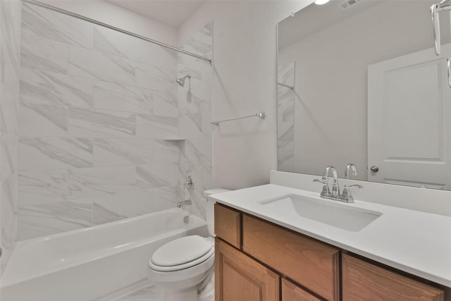 full bathroom with vanity, toilet, and tiled shower / bath combo