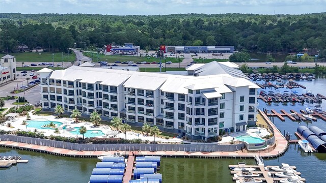 birds eye view of property with a water view