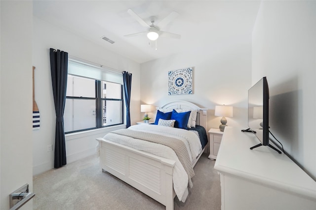 bedroom with light colored carpet and ceiling fan