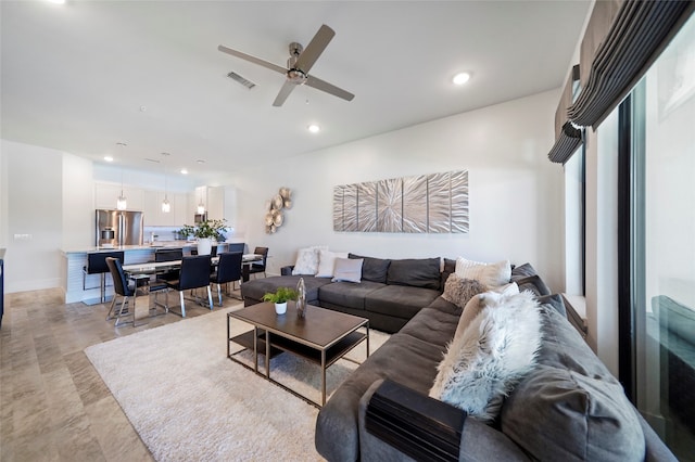 living room featuring ceiling fan