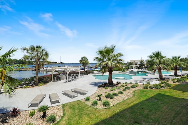 view of property's community featuring a water view, a swimming pool, and a lawn