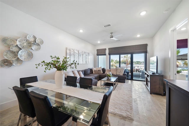 dining room with a wealth of natural light and ceiling fan