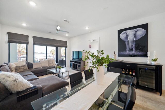 tiled living room featuring ceiling fan