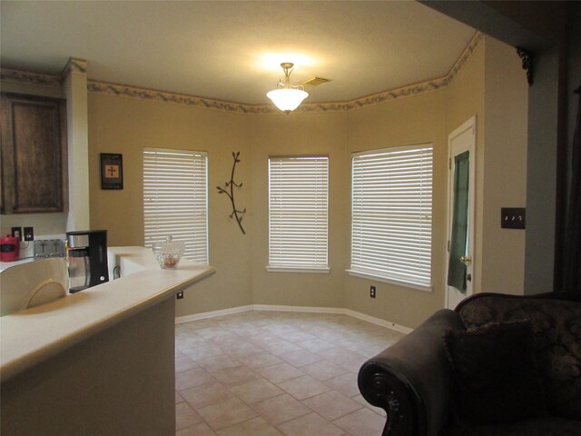 dining area featuring light tile patterned floors