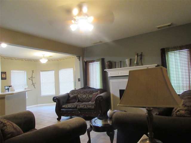 living room with light tile patterned flooring and ceiling fan