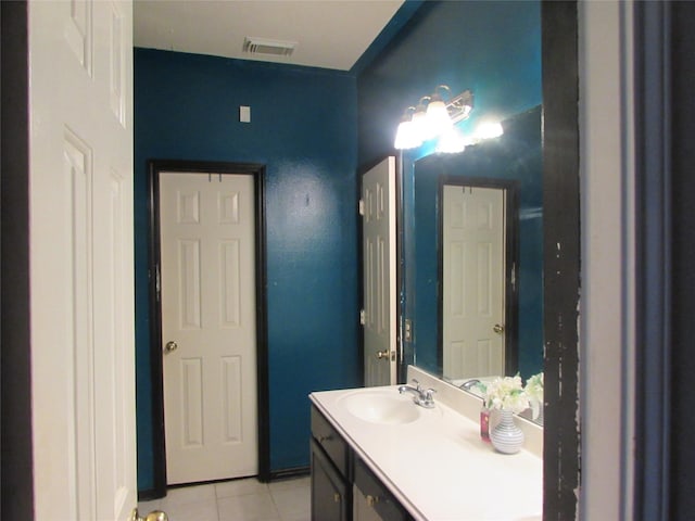 bathroom with tile patterned floors and vanity