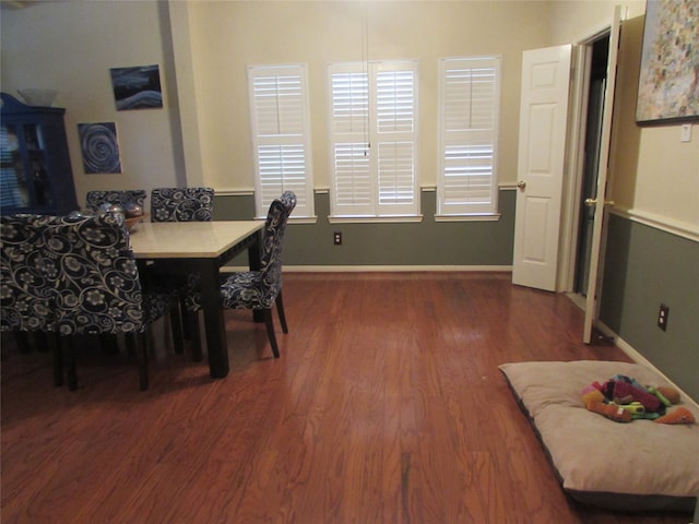 dining space with dark wood-type flooring