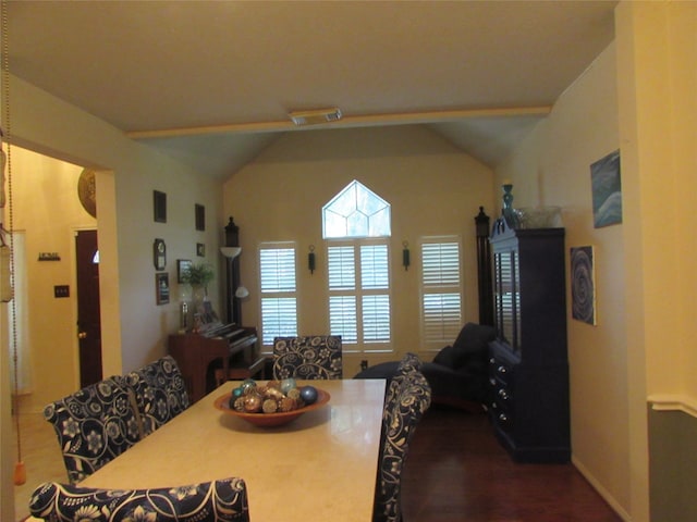 dining space with hardwood / wood-style flooring and lofted ceiling