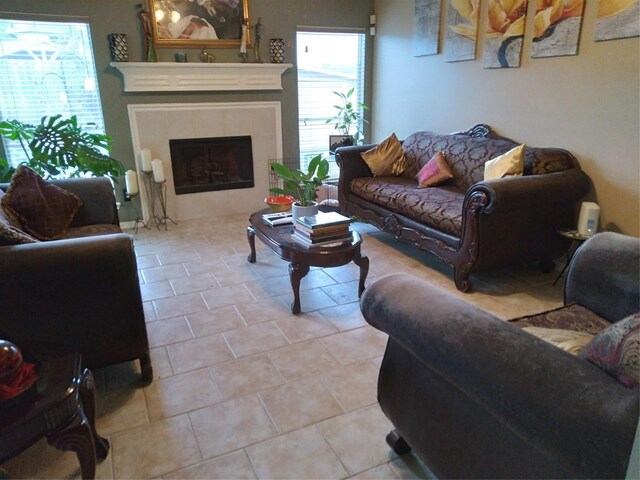 tiled living room with a tile fireplace and plenty of natural light