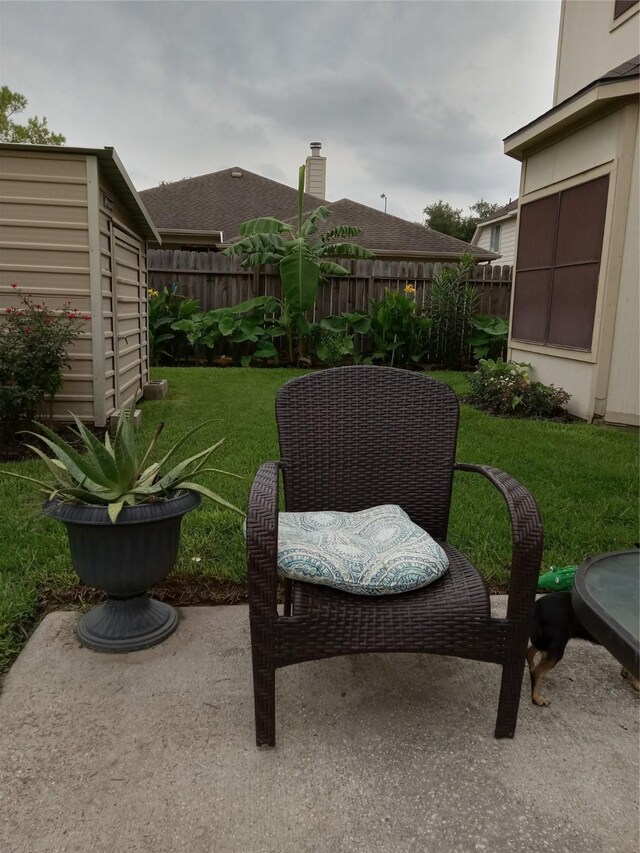 view of patio / terrace featuring a shed