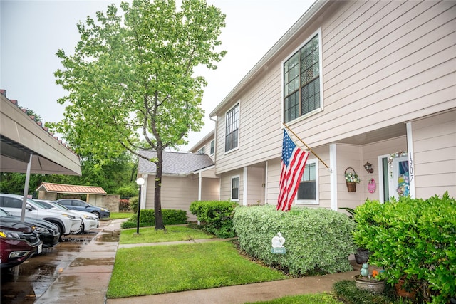 view of property exterior with a yard