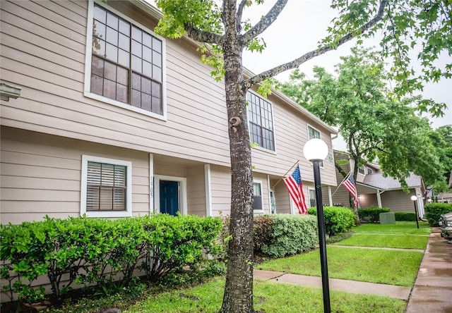 view of property exterior featuring a yard