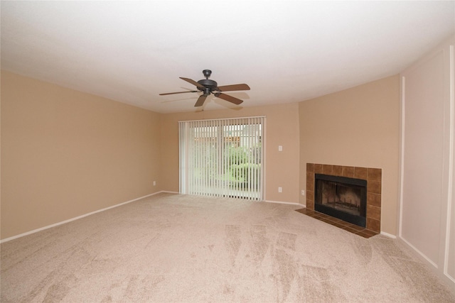 unfurnished living room featuring a fireplace, ceiling fan, and carpet flooring