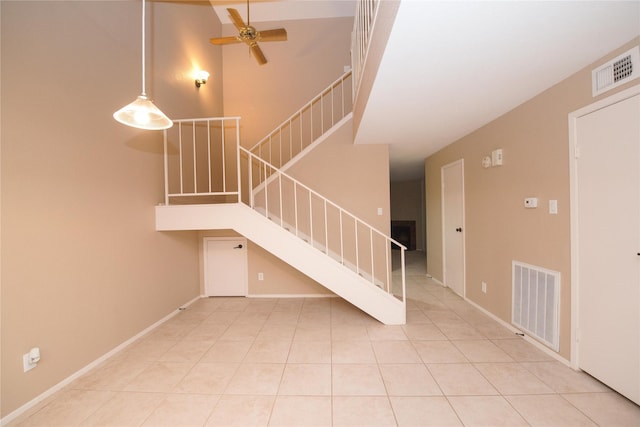 interior space with ceiling fan