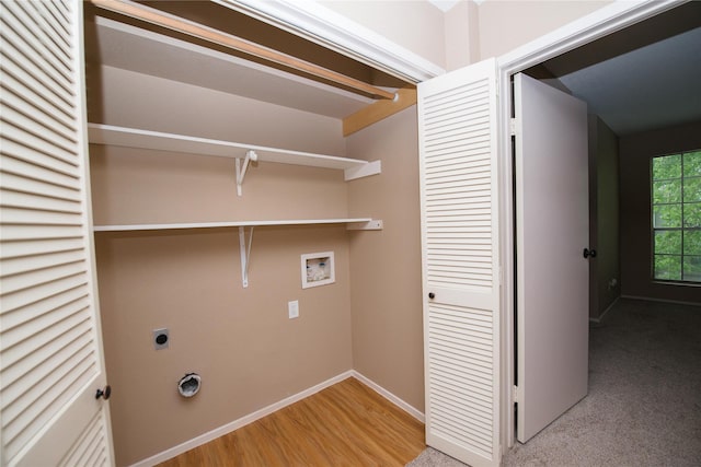 laundry area featuring hardwood / wood-style flooring, electric dryer hookup, and washer hookup