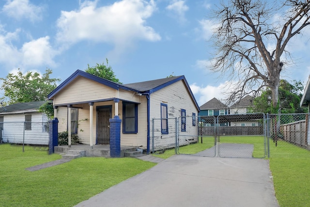 bungalow with a front yard, a gate, fence, and covered porch