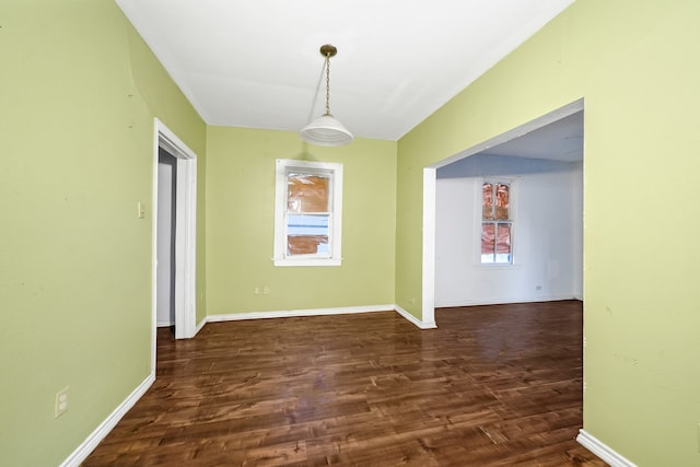 empty room with hardwood / wood-style floors