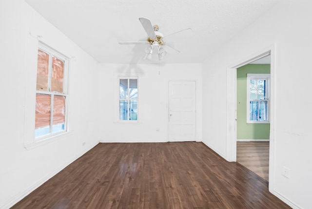 unfurnished room with hardwood / wood-style flooring and ceiling fan