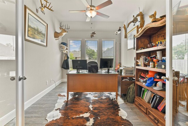 office area with ceiling fan, light hardwood / wood-style flooring, and plenty of natural light